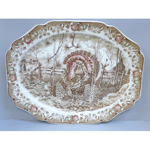 613 - A large Johnson Bros. 'His Majesty' brown transferware turkey plate