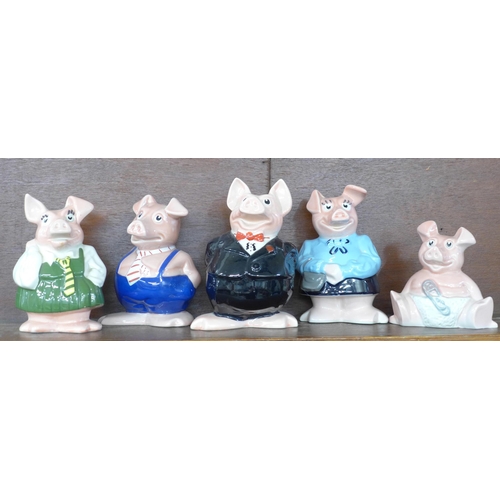 614 - A set of five Wade Nat West pig money banks