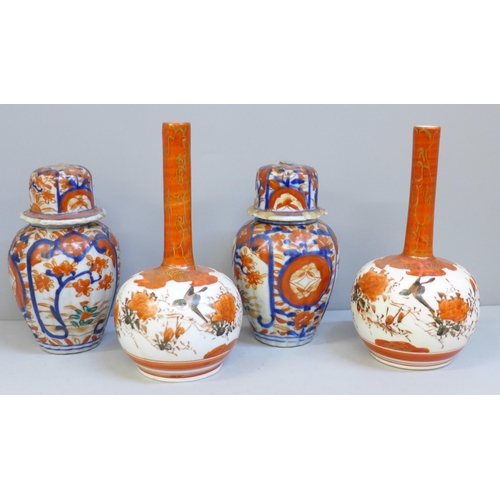 620 - A pair of Japanese Kutani bottle vases and a pair of Imari lidded vases, a/f