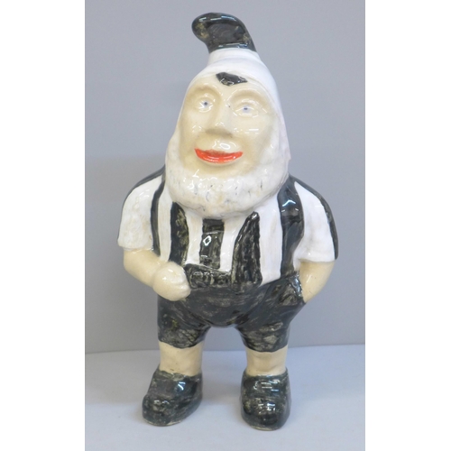 629 - A glazed pottery garden gnome, light crazing, 25cm