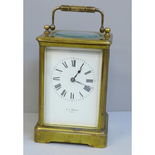 632 - A heavy brass carriage clock, A.J. Wright, Paris, Maltese Cross winding protection, strikes on gong,... 