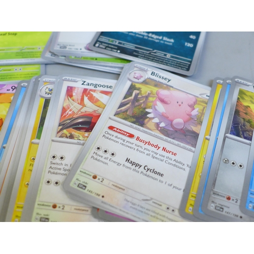 637 - Over 500 assorted Pokemon cards in ETB box, some shiny cards