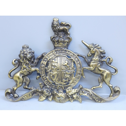 639 - A Victorian brass Royal Coat of Arms plaque, 28cm