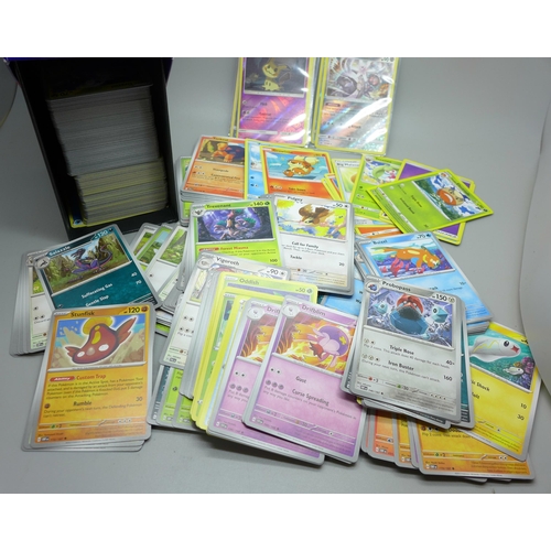 641 - Over 500 assorted Pokemon cards in ETB box, some shiny cards