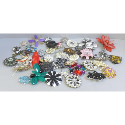 653 - Fifty large costume brooches