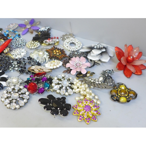 653 - Fifty large costume brooches