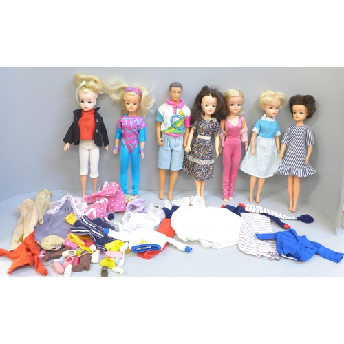 656 - Six vintage Pedigree Sindy dolls, one Paul, Sindy clothes and shoes