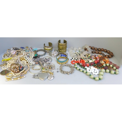 660 - Three bags of costume jewellery, necklaces and bangles