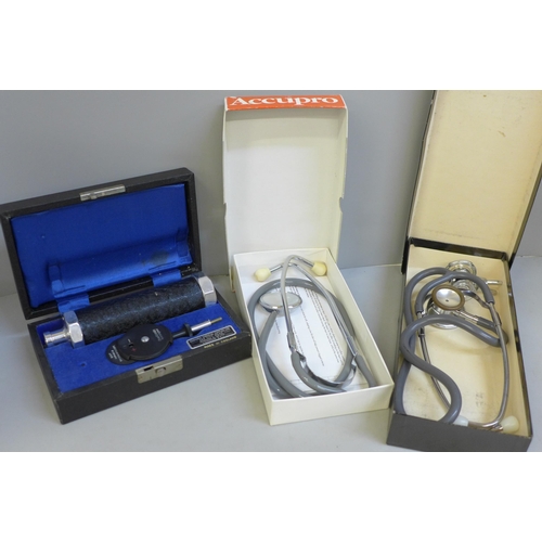 694 - Two stethoscopes and an ophthalmoscope