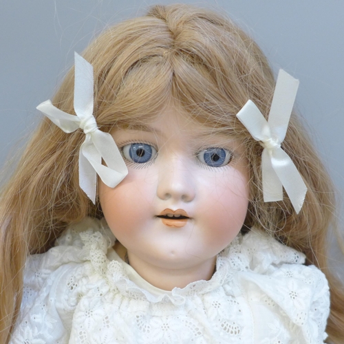 700 - A large antique German Armand Marseille bisque head doll, 390A8M, height 24