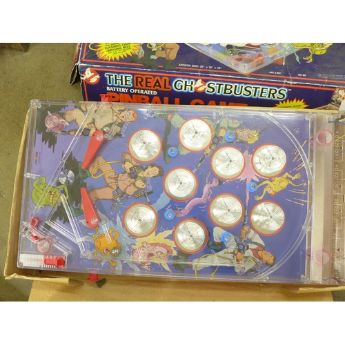 754 - A Ghostbuster battery operated Pinball Game, a Matchbox Action Zillion white light beam game, Rolf H... 