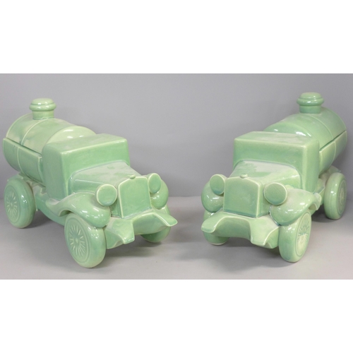 755 - A pair of mid 20th Century green ceramic water trucks/tankers, 33cm