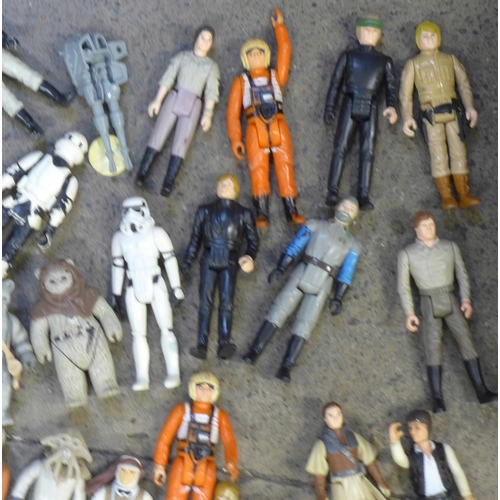 765 - A collection of Star Wars figures and a Millennium Falcon