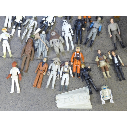 765 - A collection of Star Wars figures and a Millennium Falcon