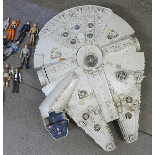 765 - A collection of Star Wars figures and a Millennium Falcon