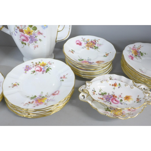 773 - A Royal Crown Derby Derby Posies tea and dinner service, 18 plates, 10 teacups, 9 coffee cups, a pai... 