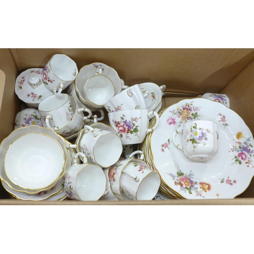 773 - A Royal Crown Derby Derby Posies tea and dinner service, 18 plates, 10 teacups, 9 coffee cups, a pai... 