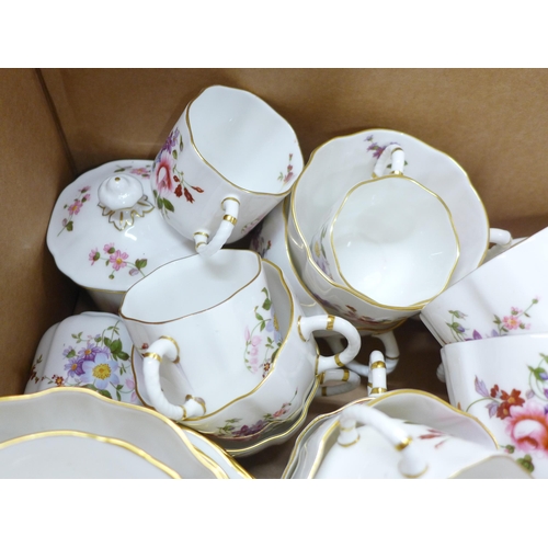 773 - A Royal Crown Derby Derby Posies tea and dinner service, 18 plates, 10 teacups, 9 coffee cups, a pai... 