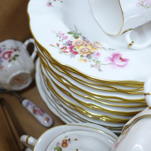 773 - A Royal Crown Derby Derby Posies tea and dinner service, 18 plates, 10 teacups, 9 coffee cups, a pai... 