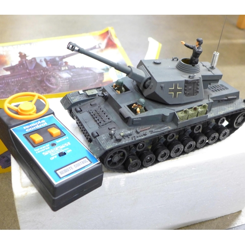 775 - A radio controlled battery operated Tiger Tank, EM-315, boxed and a Maisto Jaguar XD220, boxed