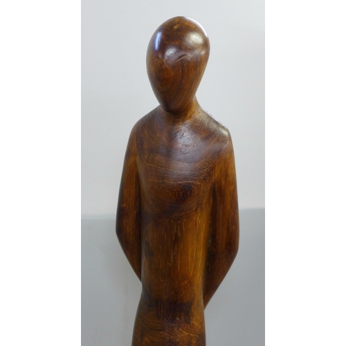 786 - Three carved figures, one a/f, one signed M. Khumalo, 1976