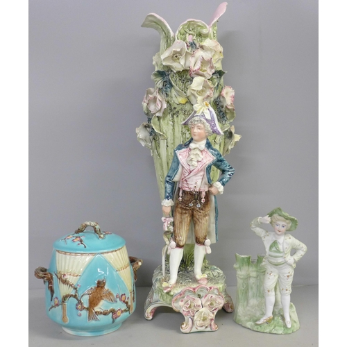 788 - A tall German porcelain figural spill vase, a small bisque spill holder and a 19th Century Wedgwood ... 