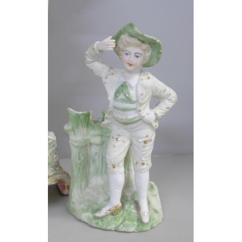 788 - A tall German porcelain figural spill vase, a small bisque spill holder and a 19th Century Wedgwood ... 