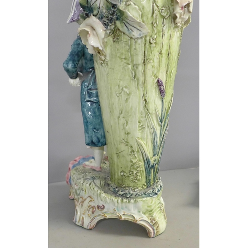 788 - A tall German porcelain figural spill vase, a small bisque spill holder and a 19th Century Wedgwood ... 