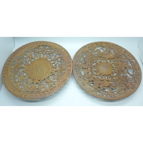 796 - Two 19th Century cast iron wall plaques, both 23cm, one with hairline crack on the rim