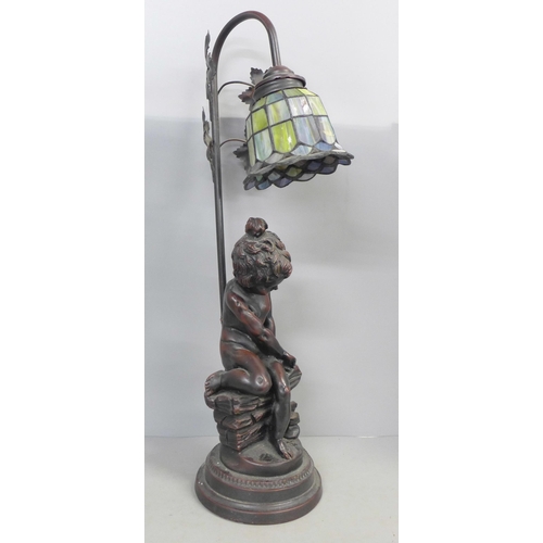 797 - A figural table lamp with glass shade, 54cm