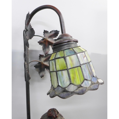 797 - A figural table lamp with glass shade, 54cm