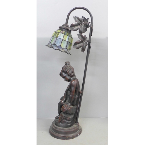 797 - A figural table lamp with glass shade, 54cm