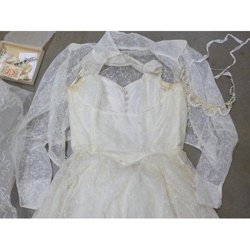 805 - A wedding dress from Thames Board Mills, Purfleet, in original box and packaging with veil, shawl, e... 