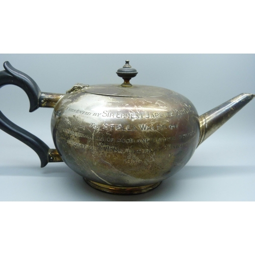 814 - A silver tea pot with inscription, 522g