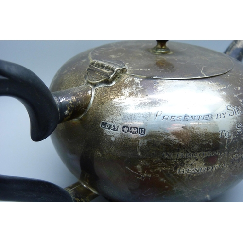 814 - A silver tea pot with inscription, 522g