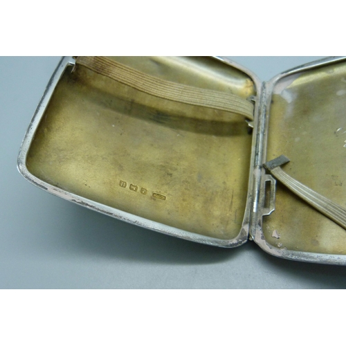 824 - A silver cigarette case and a silver vesta, 98g and 16g