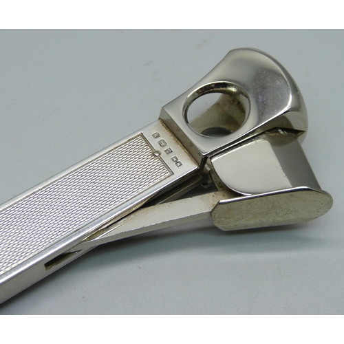 835 - A large silver cigar cutter, engine turned finish, Birmingham 1962, 15cm, 122g