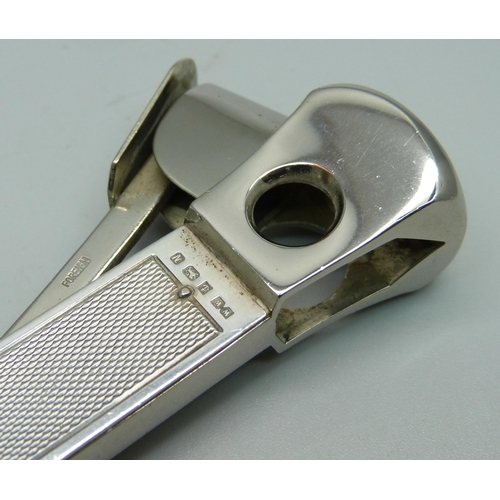 835 - A large silver cigar cutter, engine turned finish, Birmingham 1962, 15cm, 122g