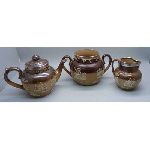 839 - A silver rimmed salt glaze tea service; teapot, sugar and cream