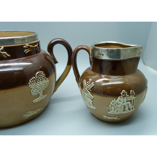 839 - A silver rimmed salt glaze tea service; teapot, sugar and cream