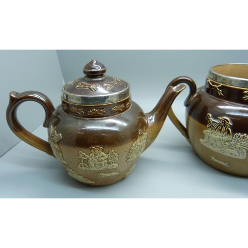 839 - A silver rimmed salt glaze tea service; teapot, sugar and cream