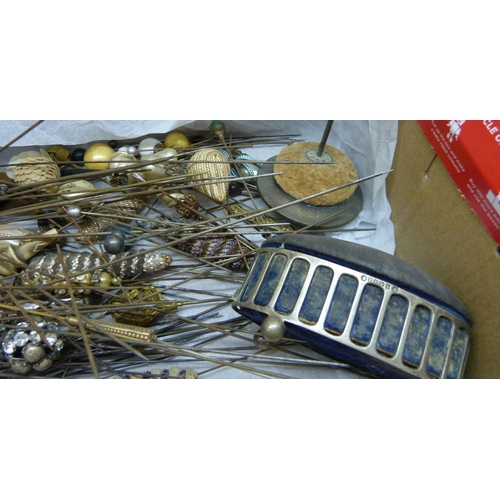 840 - A box of approximately 120 mixed hat pins including a few silver/white metal examples and two hat pi... 