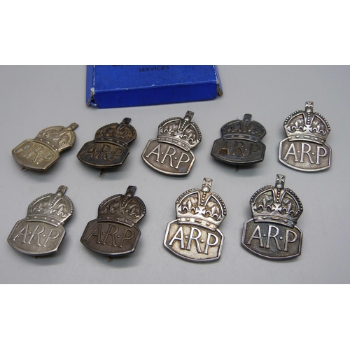 854 - Nine WWII Air Raid Precautions (ARP) silver badges, 82g