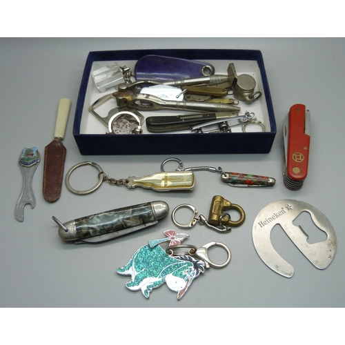 860 - Penknives, a whistle, bottle openers, etc.