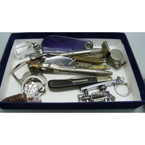 860 - Penknives, a whistle, bottle openers, etc.