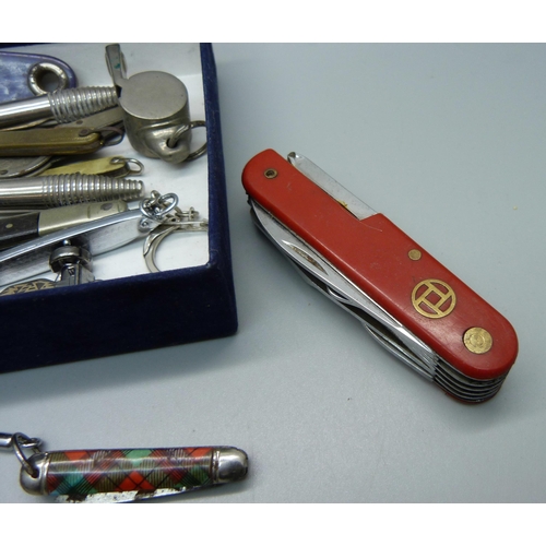 860 - Penknives, a whistle, bottle openers, etc.