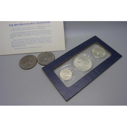 873 - Coins; a United States Bicentennial silver uncirculated set, two other dollars, 1972 and 1977