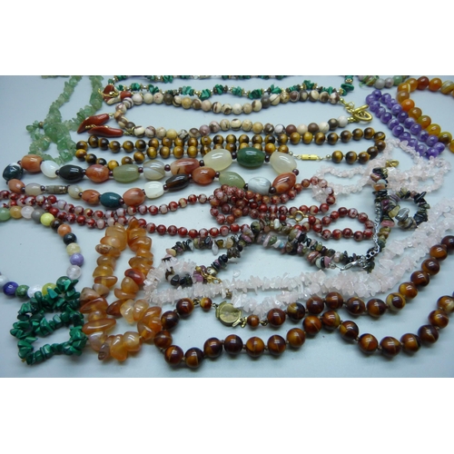 887 - Hardstone necklets and bracelets including tiger's eye, amethyst, etc.