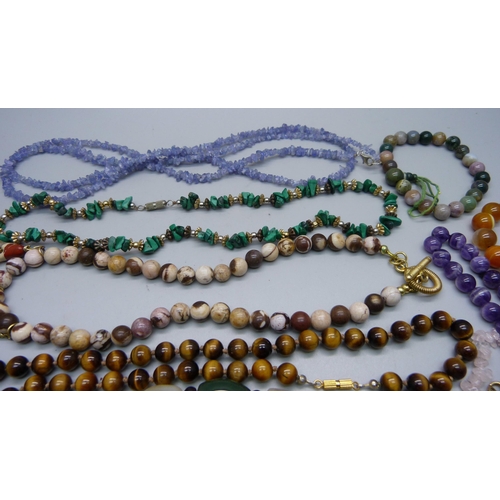 887 - Hardstone necklets and bracelets including tiger's eye, amethyst, etc.