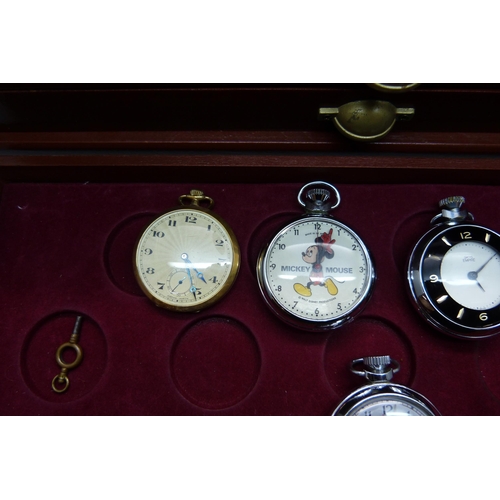 899 - A three-drawer cabinet containing thirty 'dollar' and other pocket watches, including Disney Mickey ... 